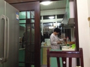 Cooking away in her PJs